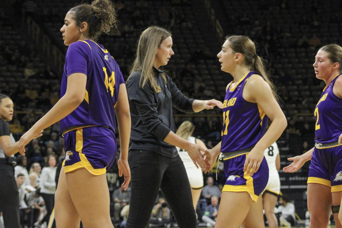 Head Coach Kari Pickens and guard Gia Casalinova celebrating during a timeout