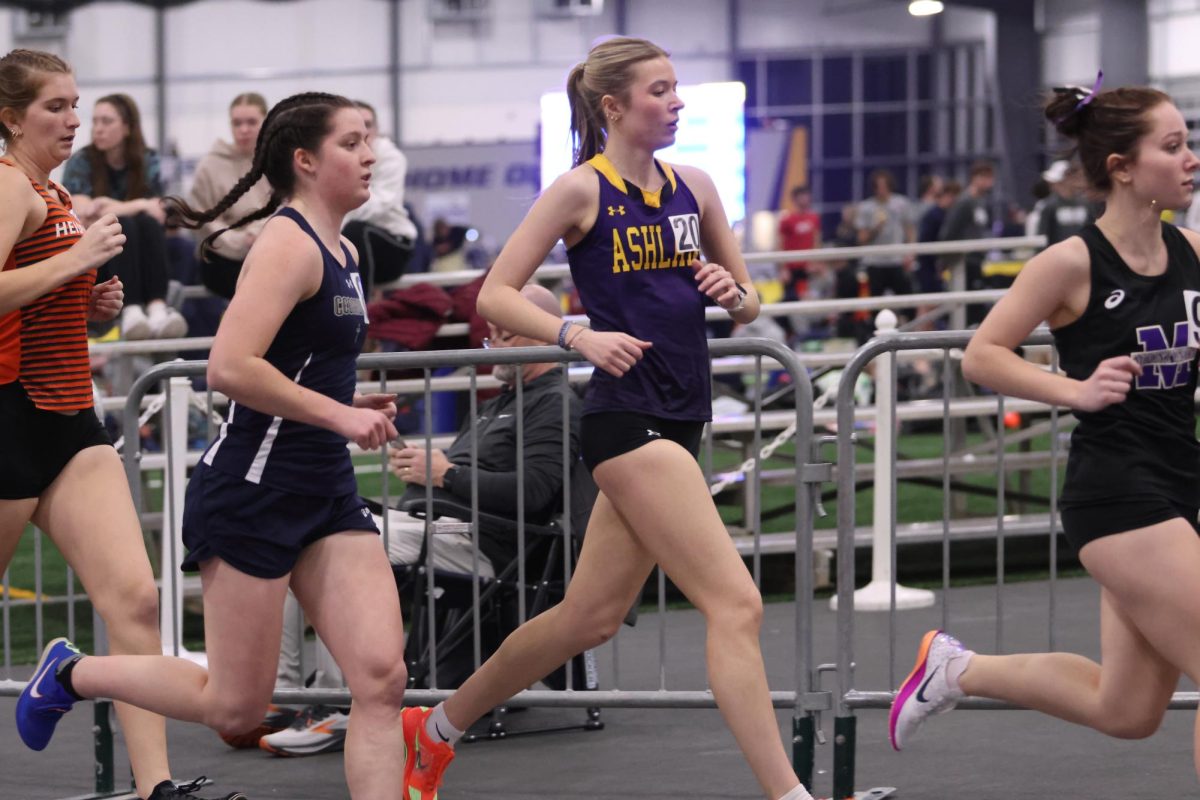 Freshman Natalie Byler running at the Light Giver Open