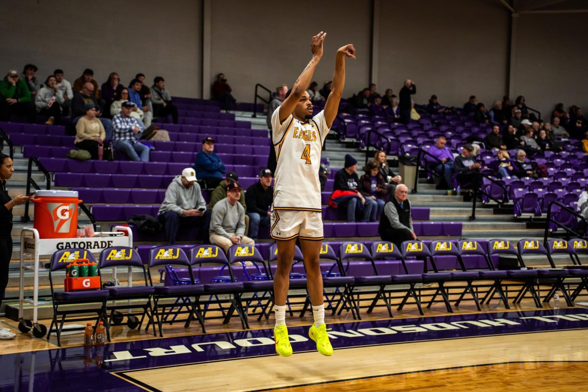 Junior wing Destin Logan shooting around during warm ups. 