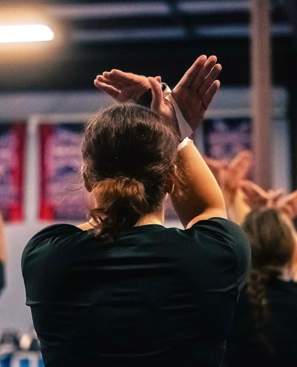 Francis throwing the “Eags up” at the end of the routine