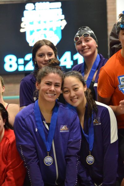 The women’s 400-medley relay on the podium after placing third.