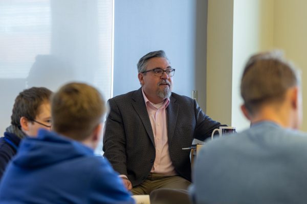 Moser builds his class discussions in a way that engages students.
