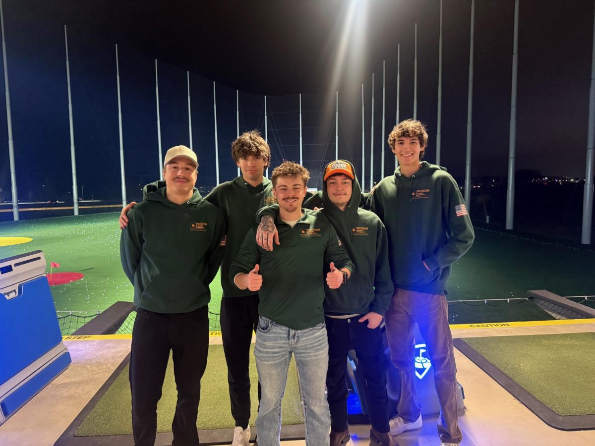 Caden Doss and his team at Top Golf.