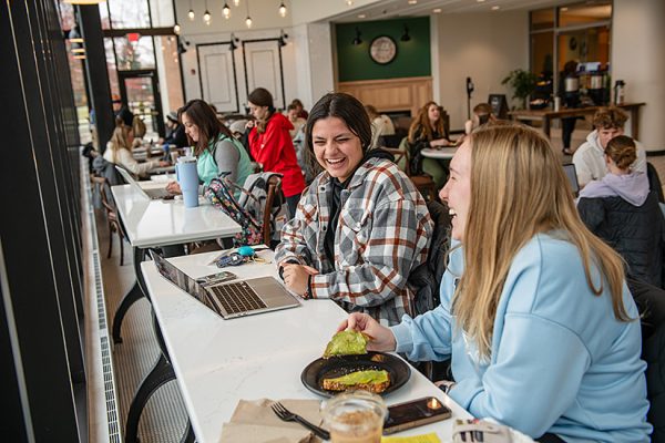 Students at Lyceum Café enjoy a drink and a meal. 