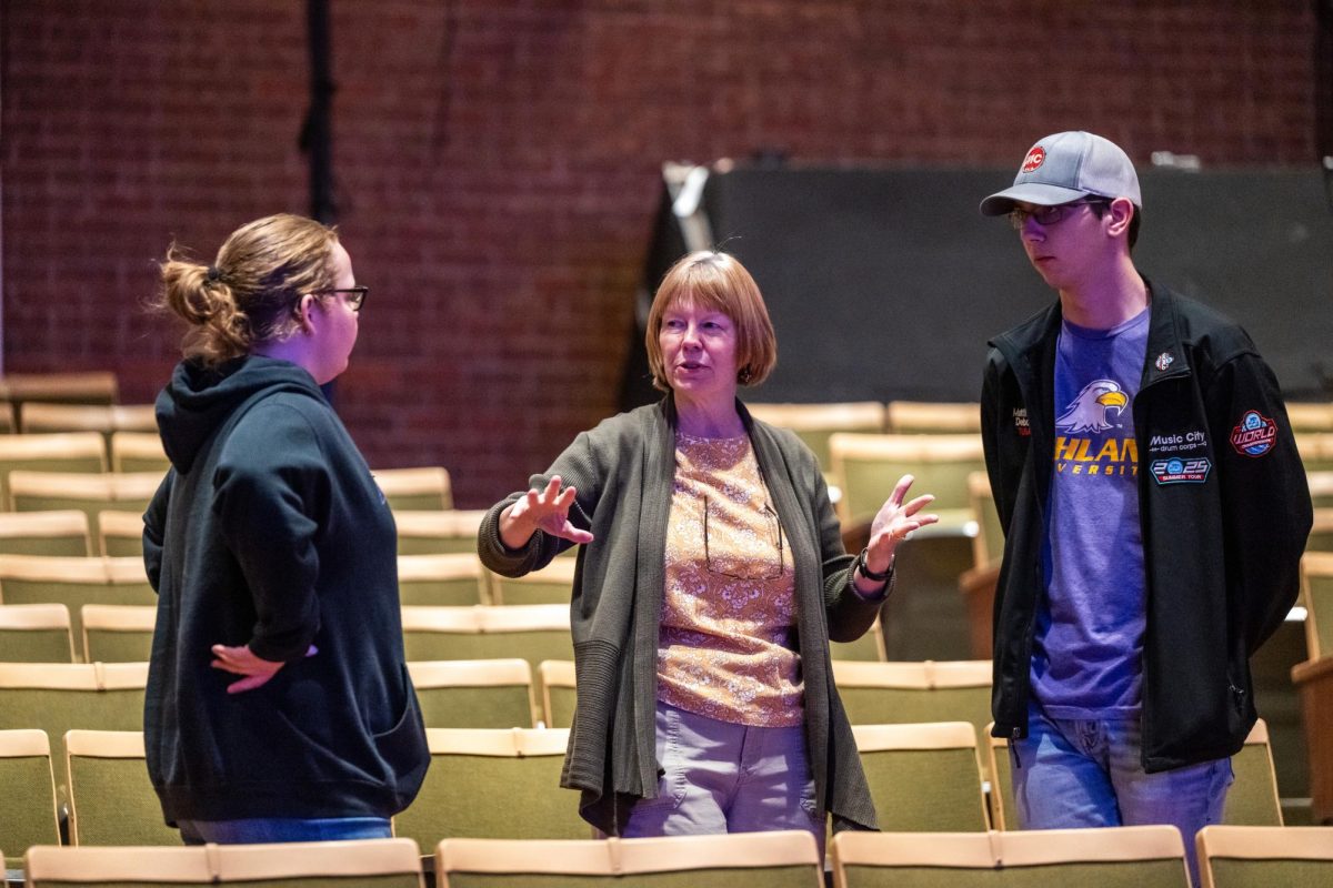 Durbin-Ames discussing the spring musical with students