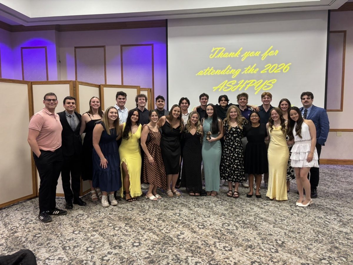 Men’s and Women’s swim and dive team after accepting the community service award, as they led all the teams with  967.5 volunteer hours.